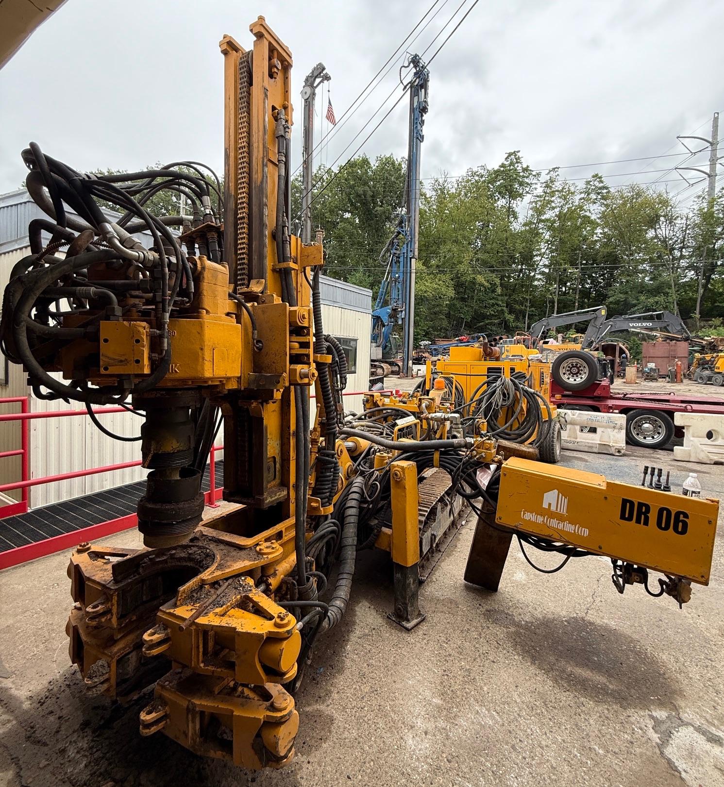 Yellow Hütte HBR 201/203 anchor & micropile drilling rig with complex hydraulics, tracks, and "DR 06".